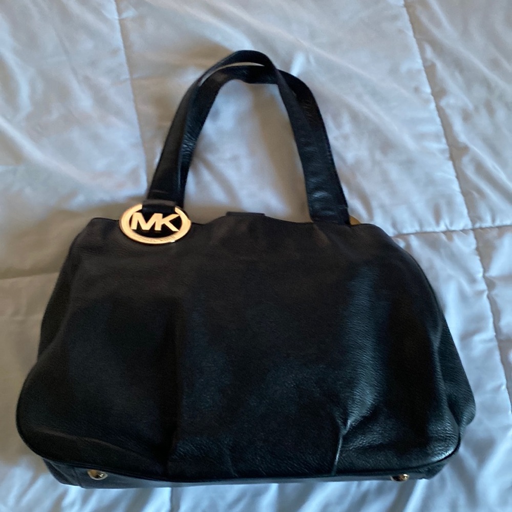 Michael Kors large black shoulder bag with gold hardware.